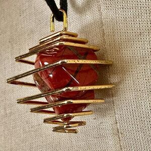 Red jasper gold tone caged pendant necklace